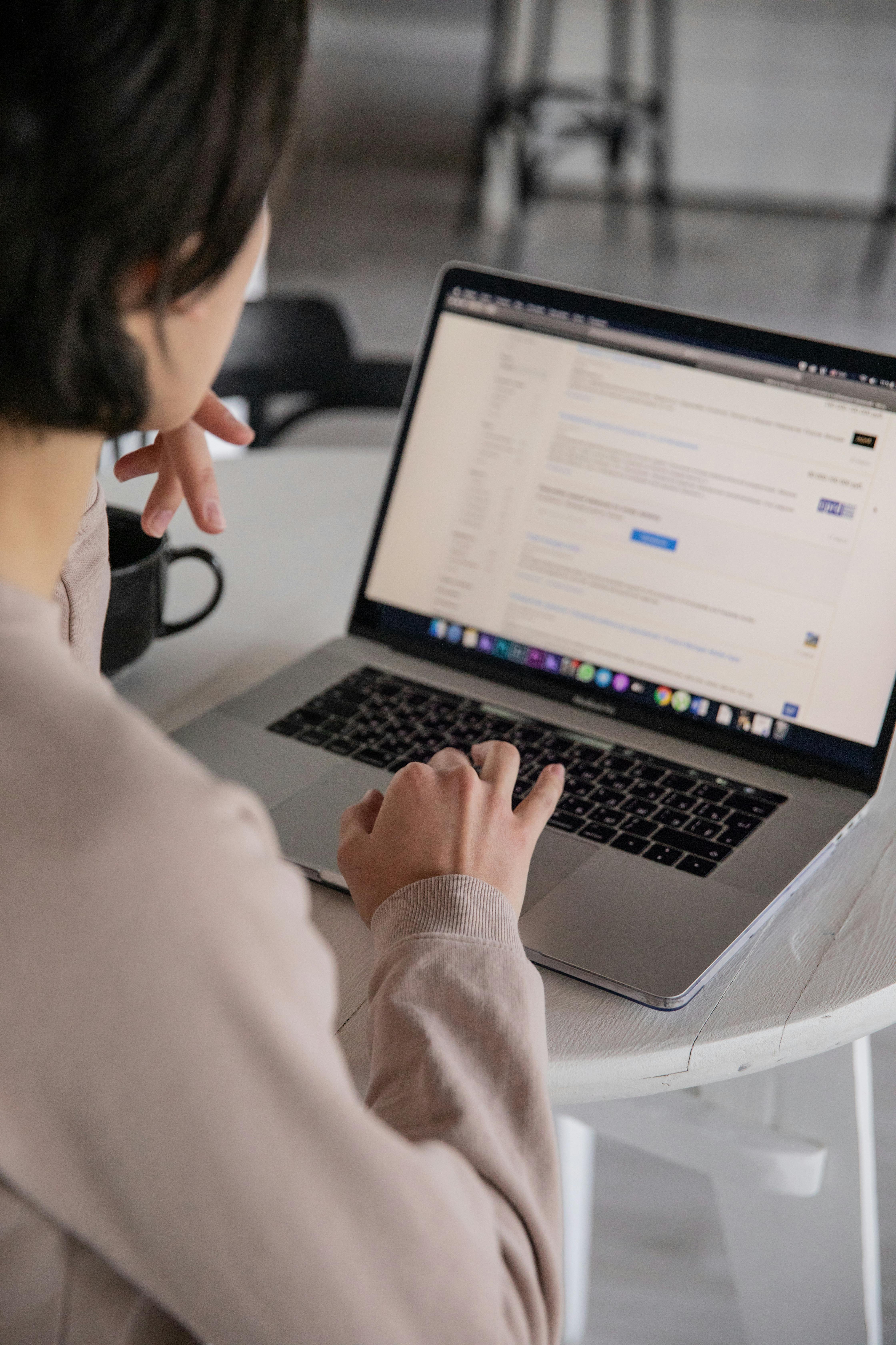 Person searching for jobs on a laptop